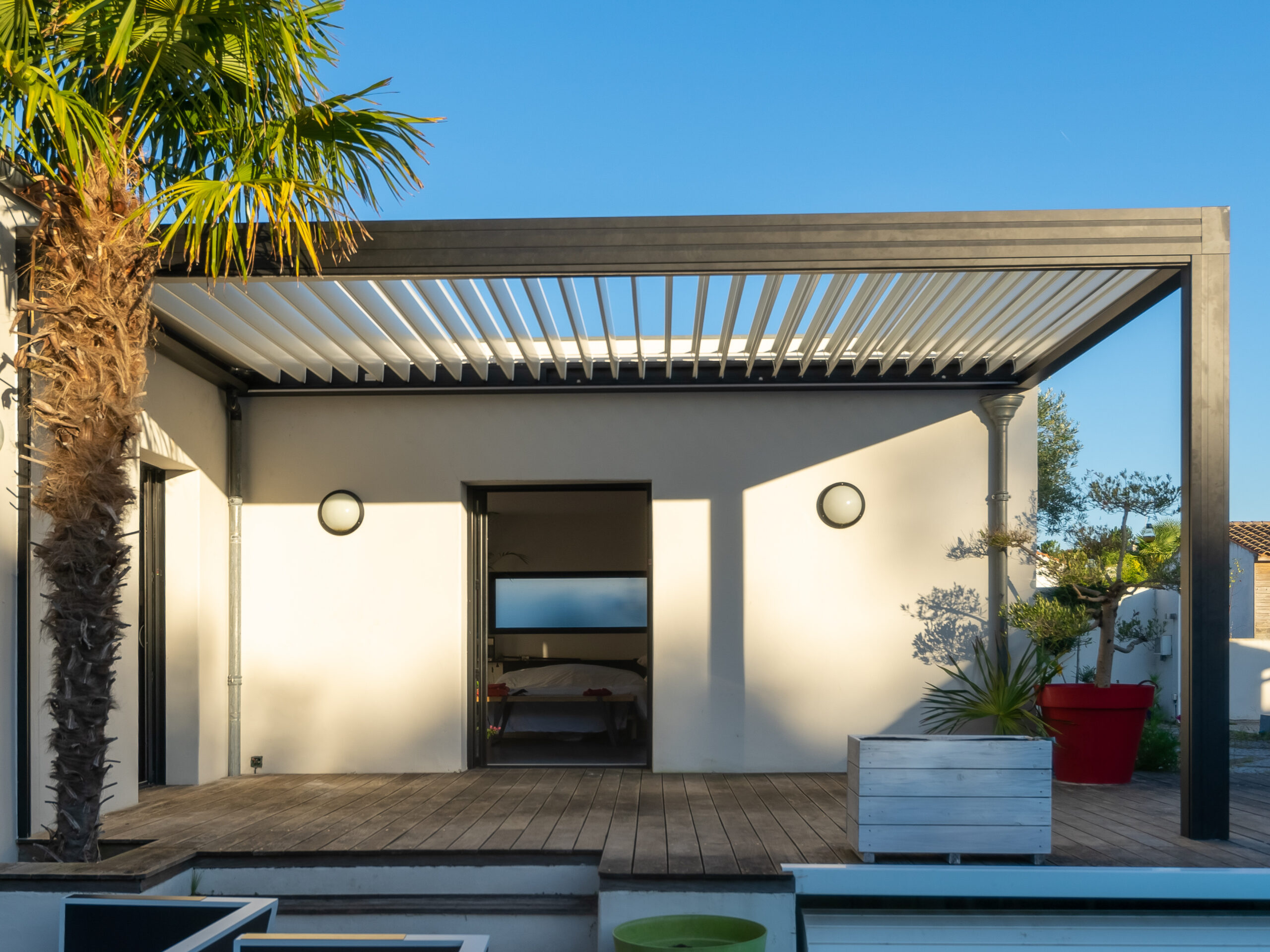 Modern louvered-roof outdoor living space