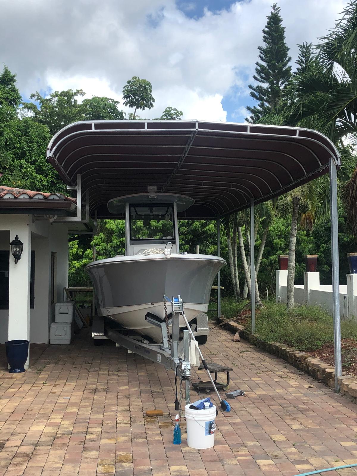 Custom carport providing covered storage for a boat