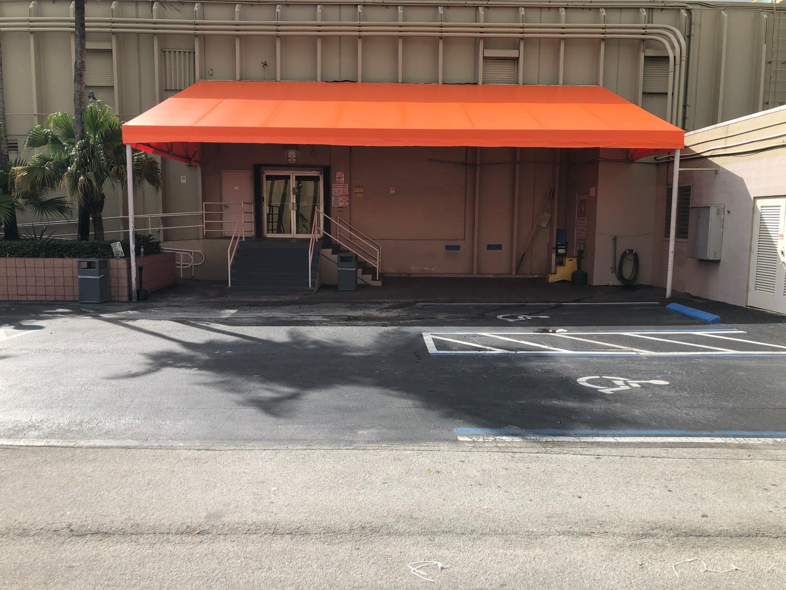 Attached carport extending coverage from the existing building